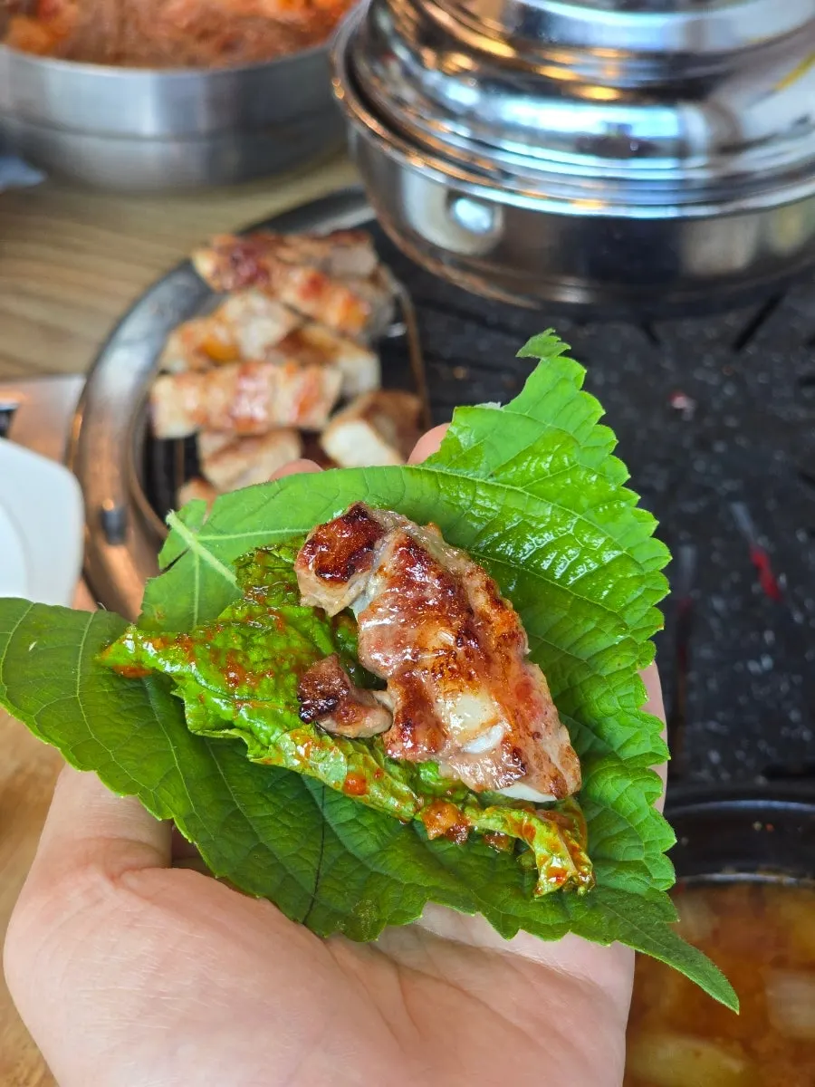 Pork belly wrapped in lettuce and perilla leaf