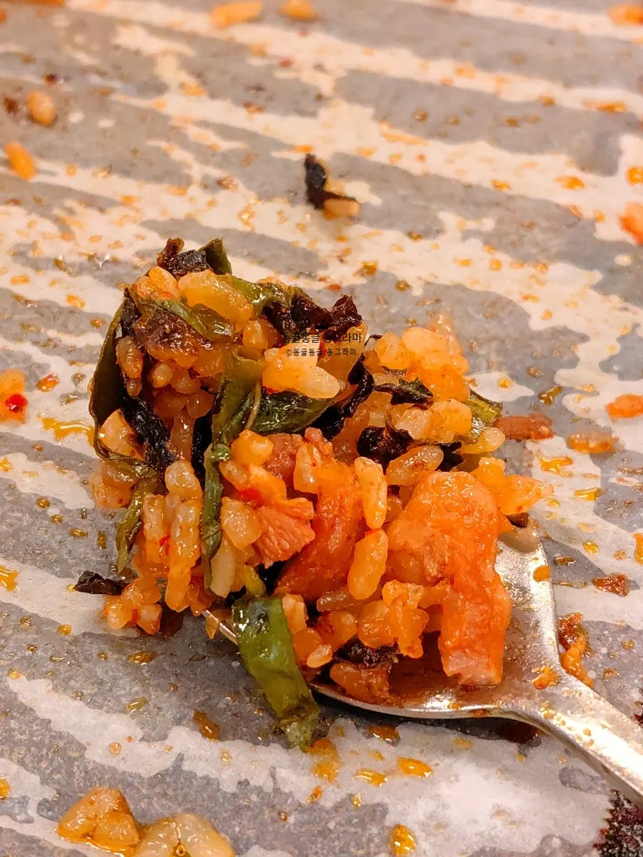 Fried rice with crispy bits stuck to the grill
