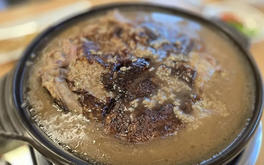 Pot of bubbling nurungji duck baeksuk