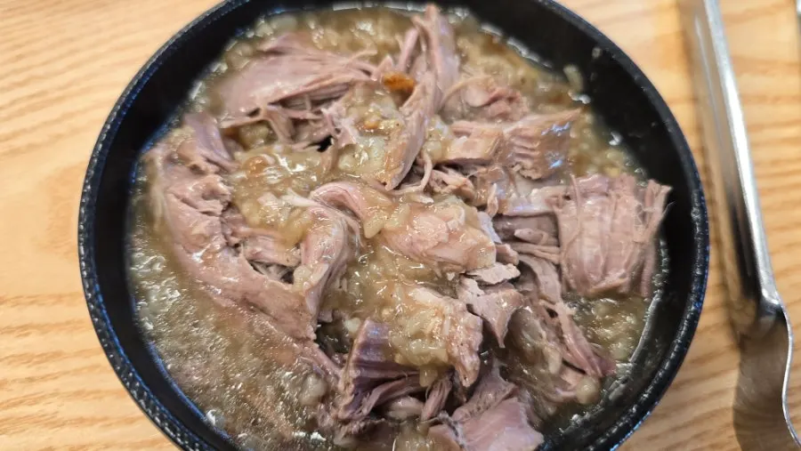 Bowl with deboned duck meat