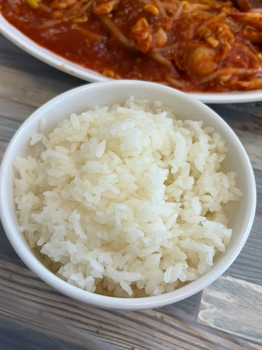Fluffy steamed rice paired with spicy seafood jjim