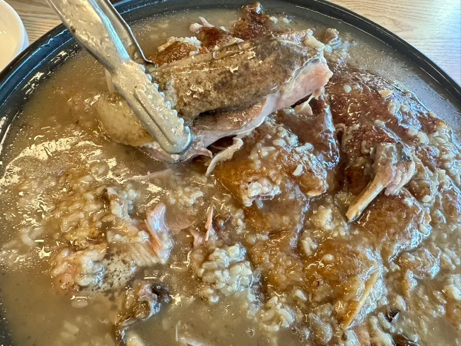 Close-up of the rich broth in the neungi duck baeksuk