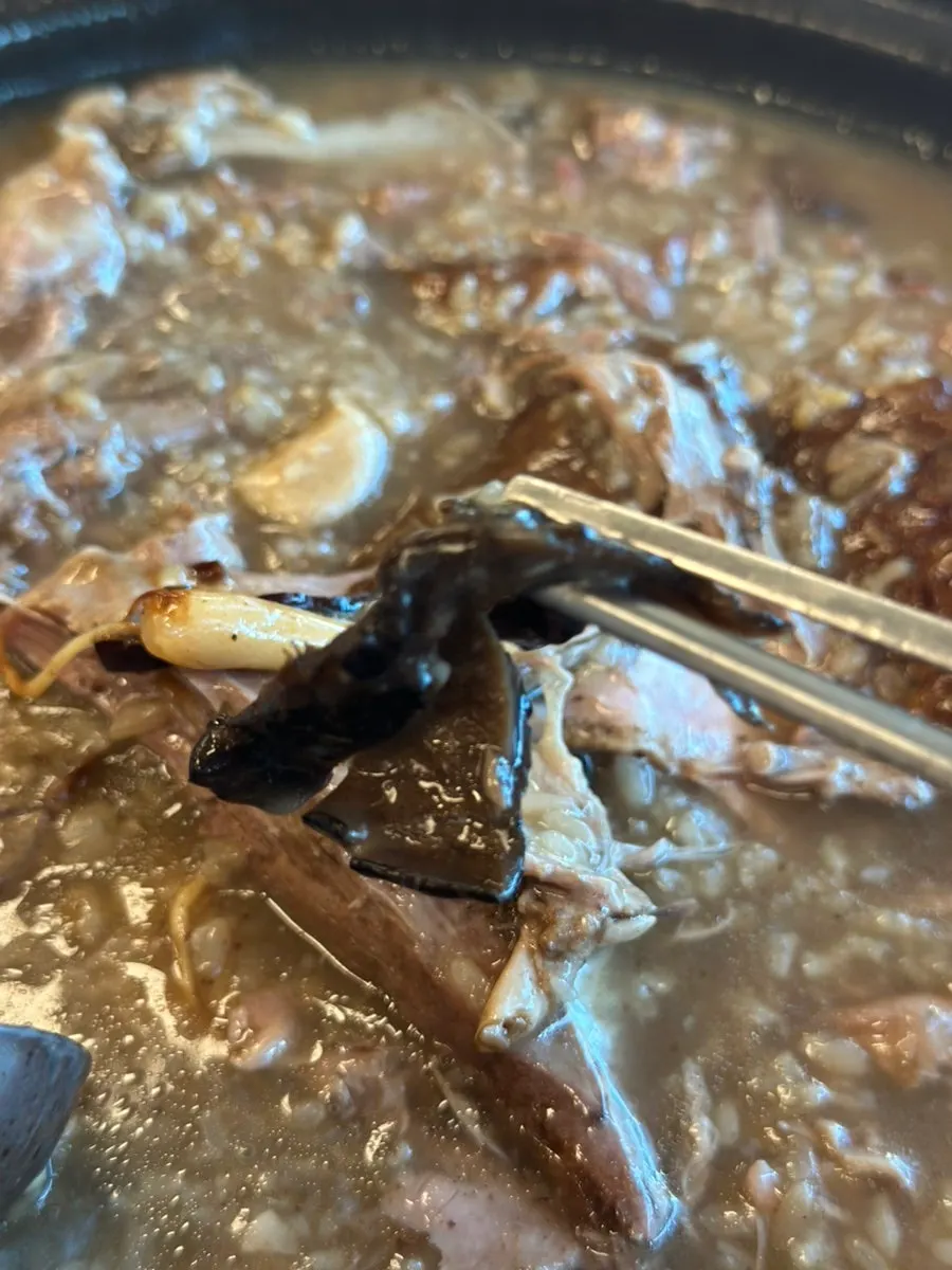 Tender cooked duck meat and nurungji sticky rice