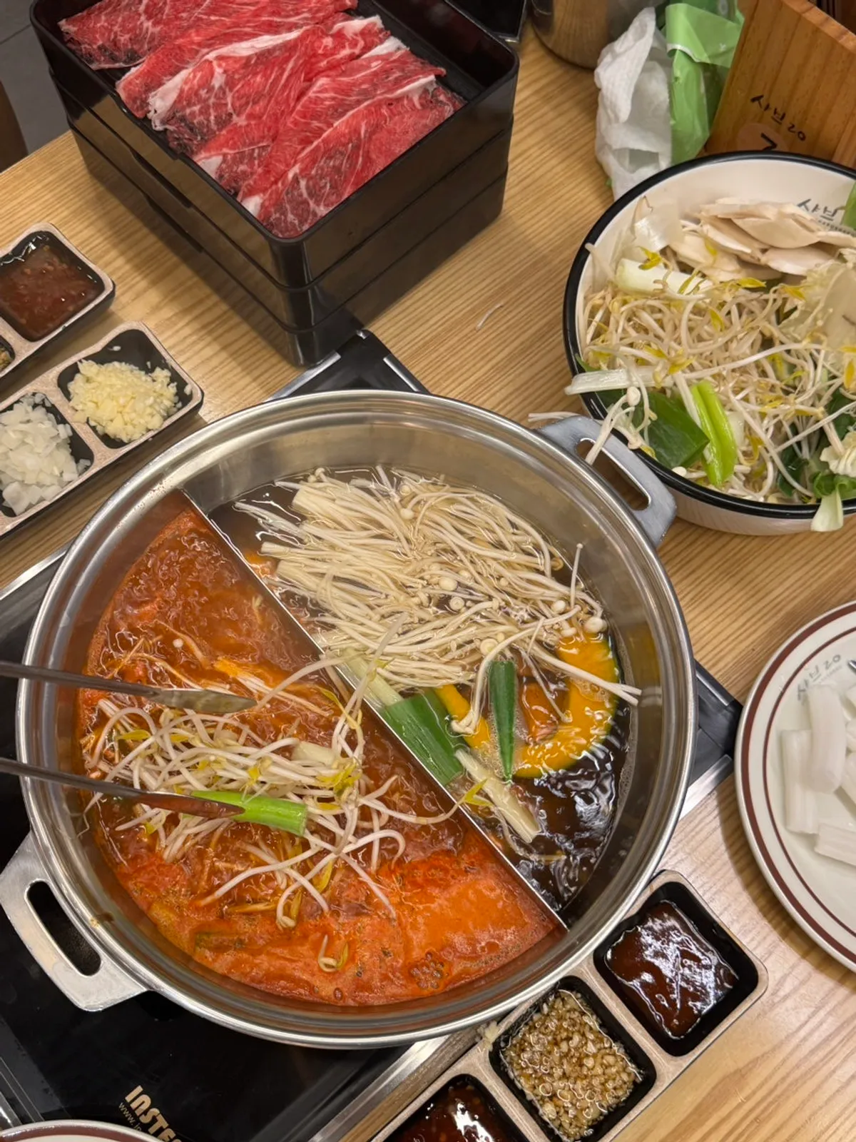 Shabu-shabu ingredients with beef and bunmoja noodles