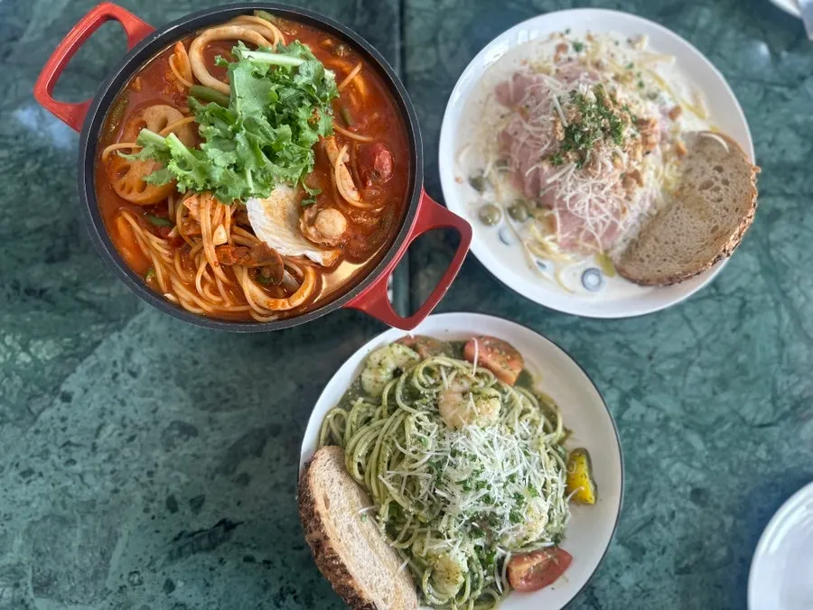 Brunch dishes laid out on a table at When You Bite