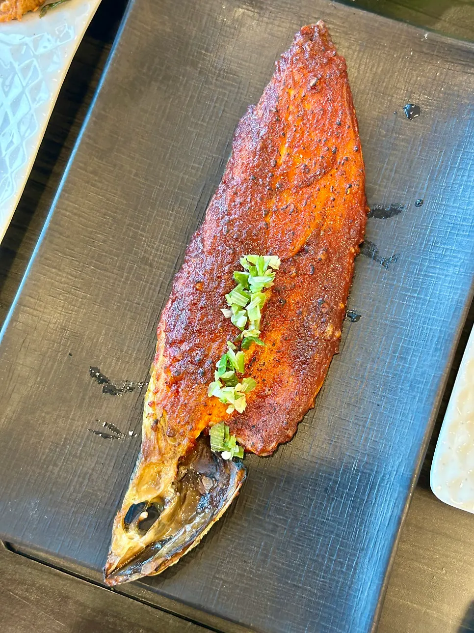 Grilled mackerel topped with red sauce