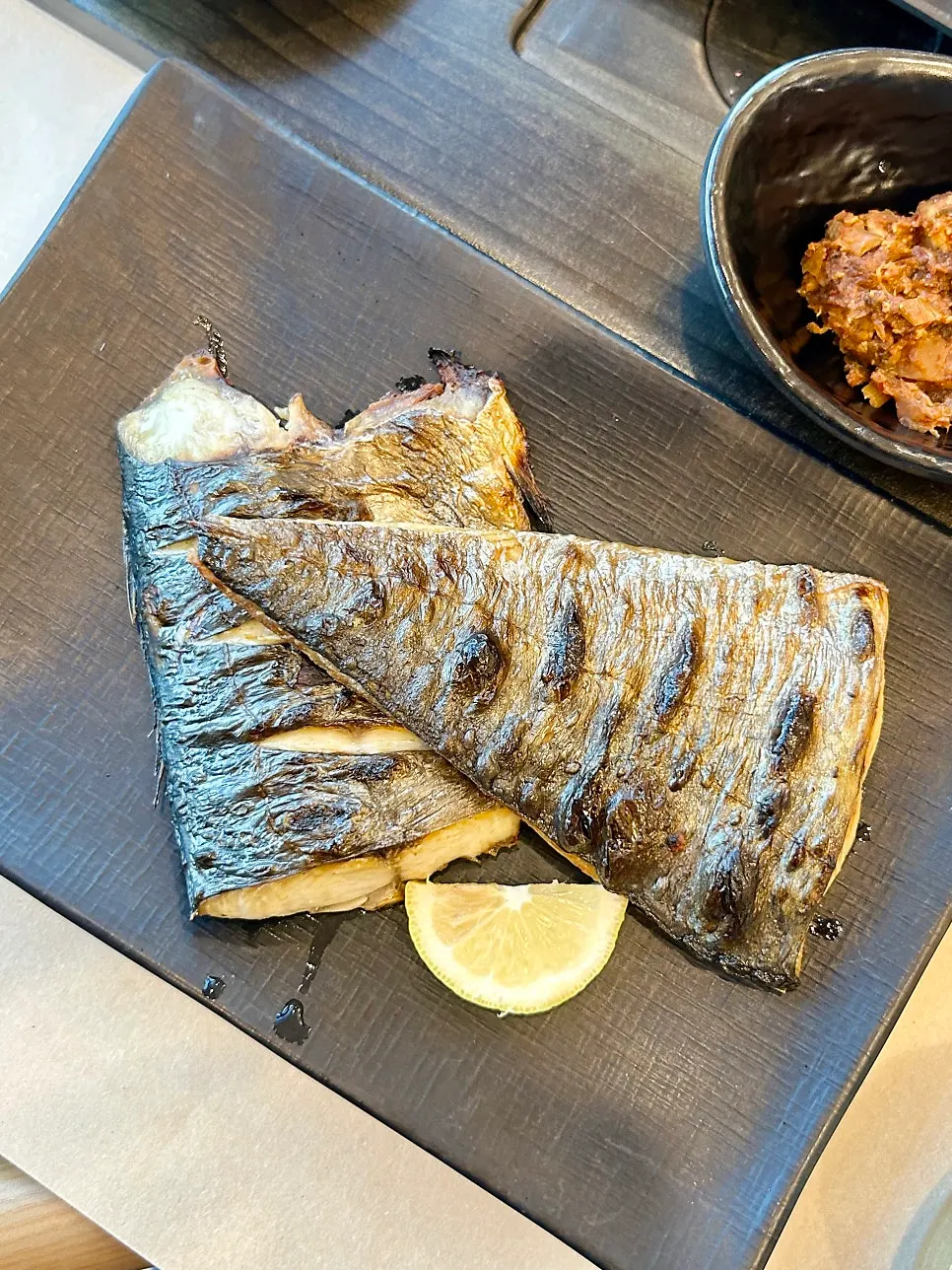 Seasoned grilled mackerel eaten with rice