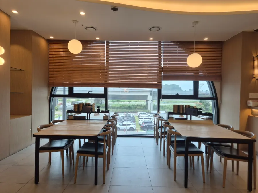 Spacious wood-tone interior of the restaurant