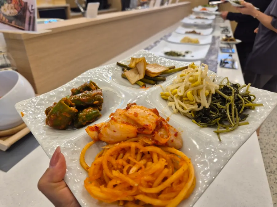 Self-serve side dishes arranged in a four-compartment dish