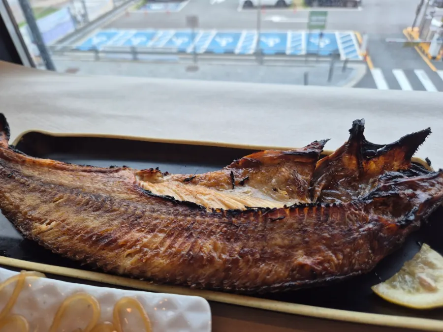 A large charcoal-grilled atka mackerel