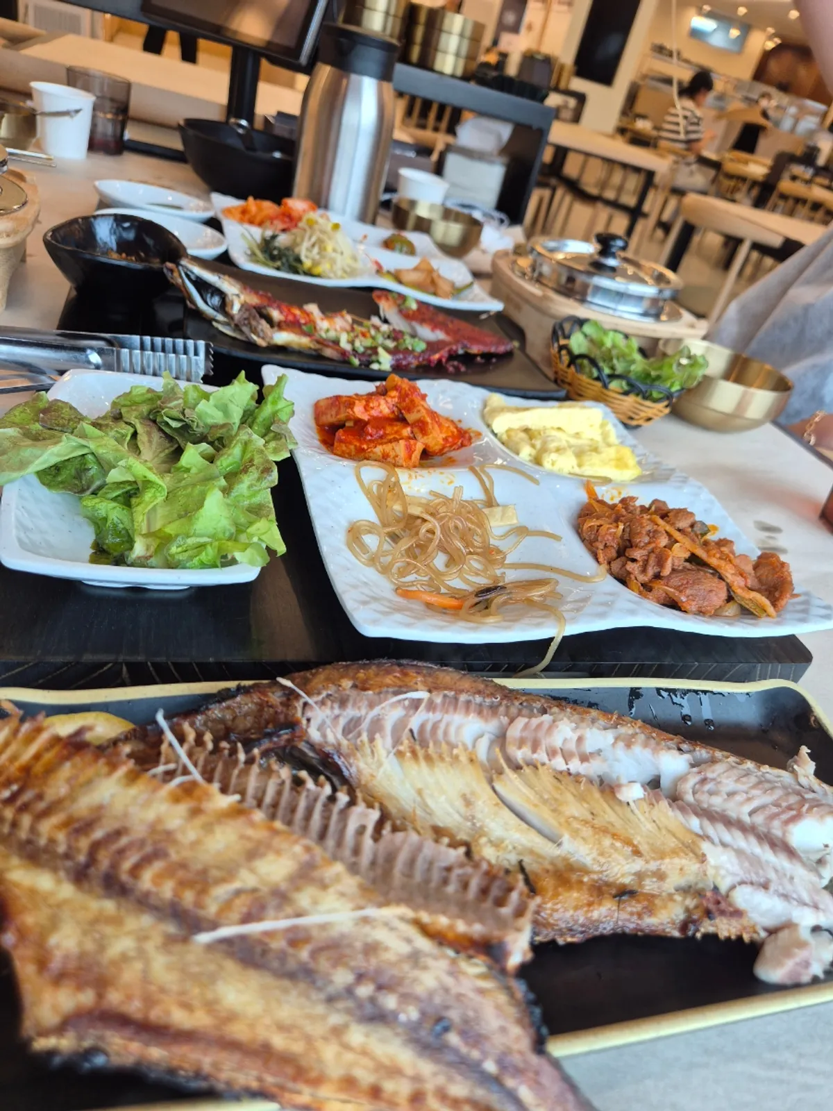 Full meal spread with pot rice and grilled fish together