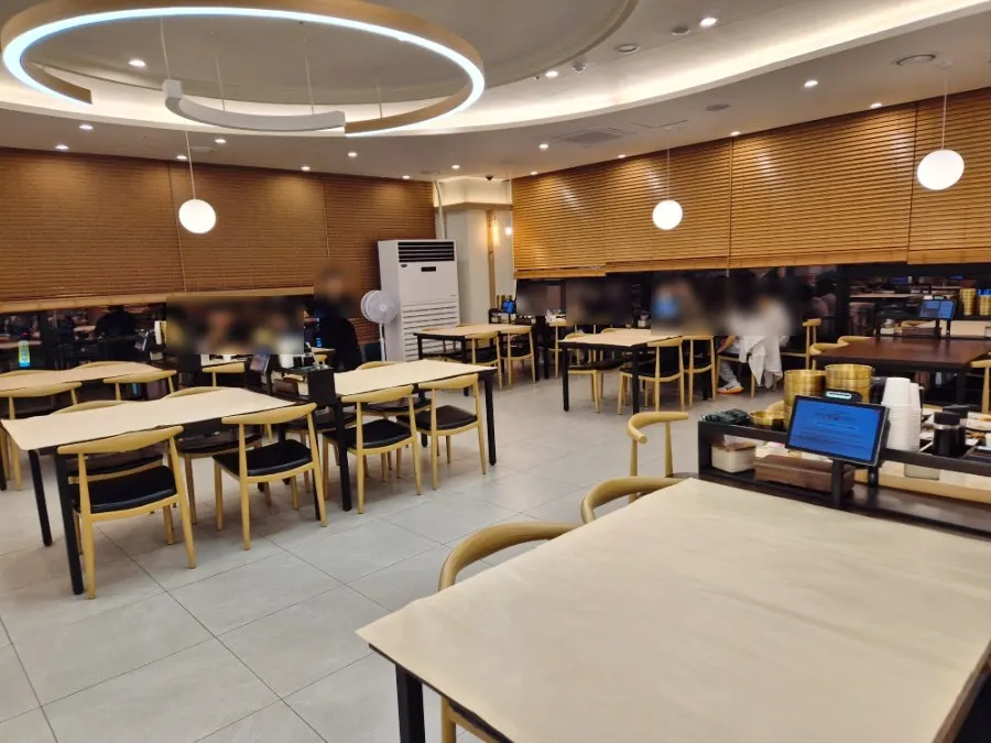 View of the dining hall with widely spaced tables