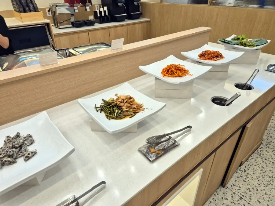 Side dishes of lotus root salad and pickled onions