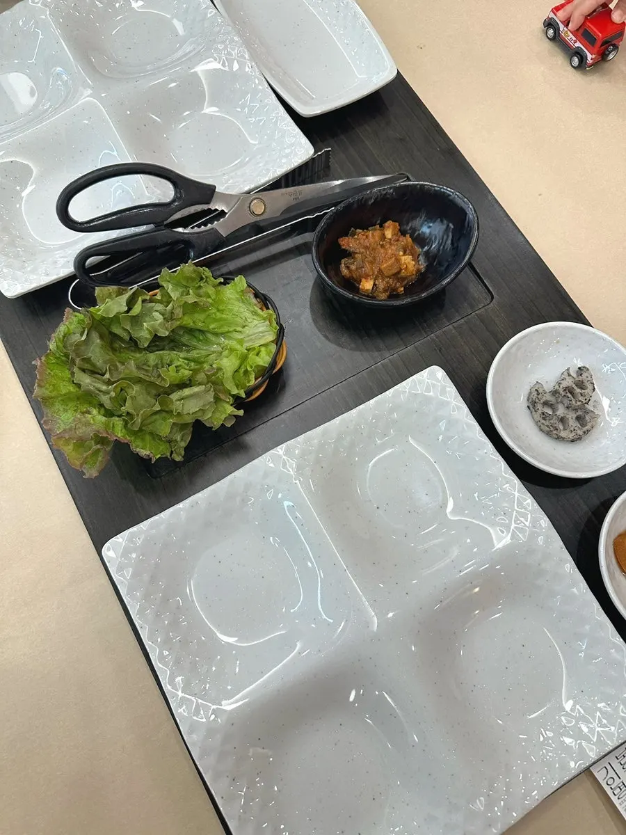 Wide table where a stroller can be placed alongside diners