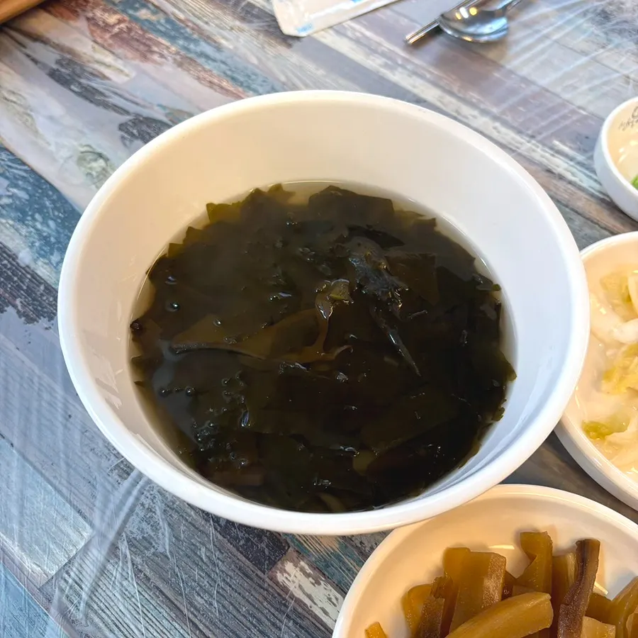 Warm seaweed soup served with steamed monkfish