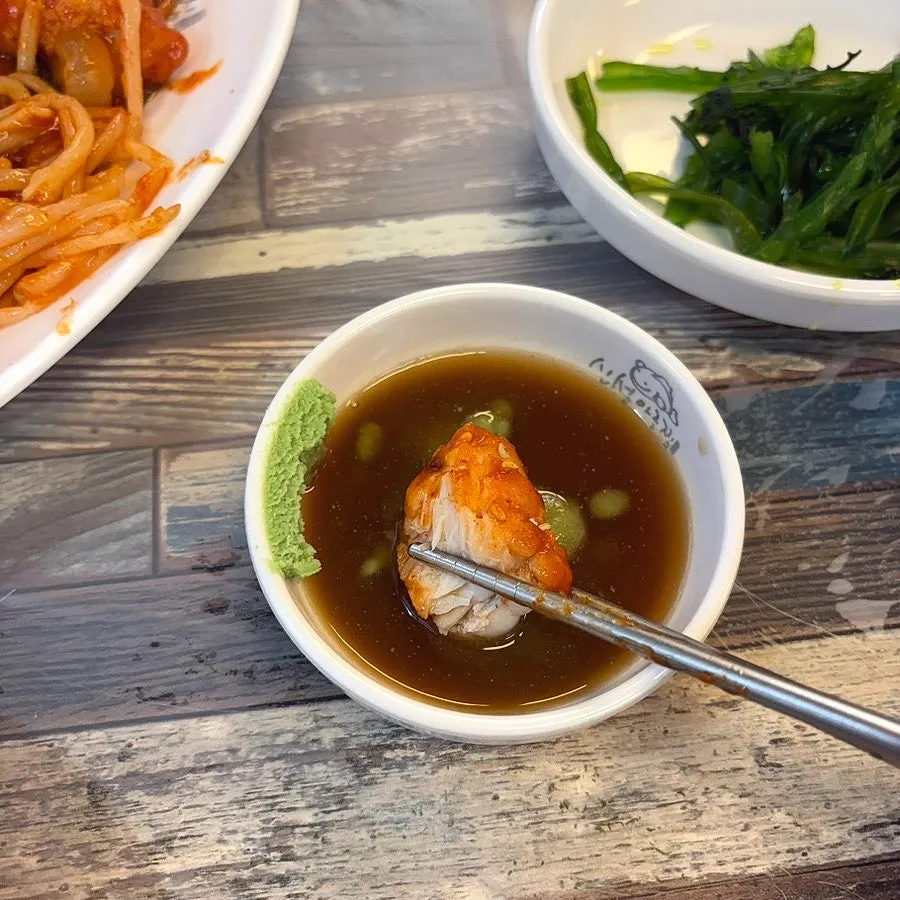 Monkfish dipped in soy sauce and wasabi