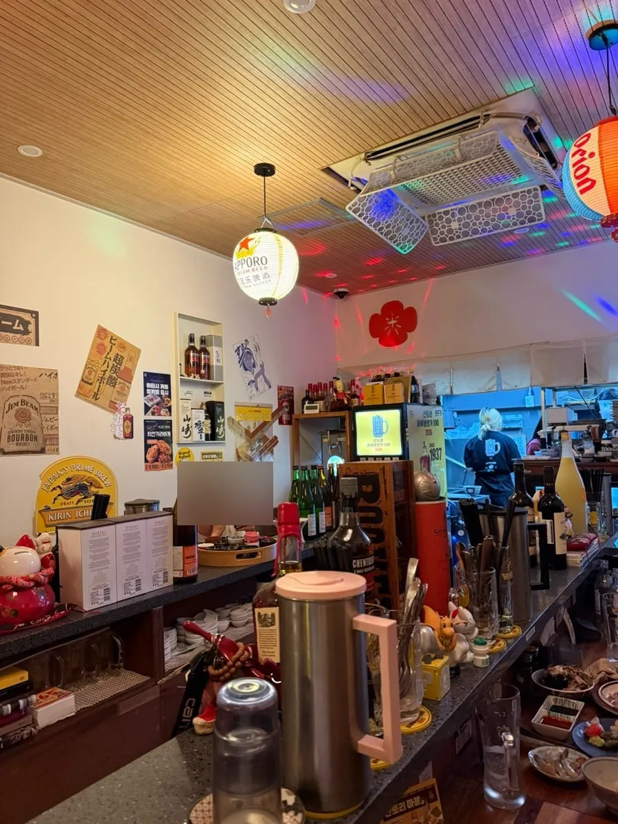 Counter seating atmosphere inside Snack Bar Atashi