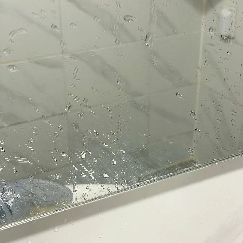 Bathroom mirror cleaning process using AutoGrooming Clean View oil-film remover