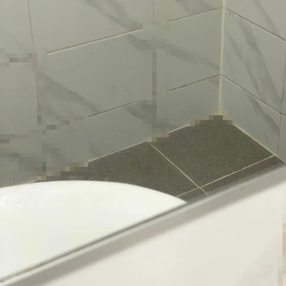 Bathroom mirror with troublesome water stains and white marks