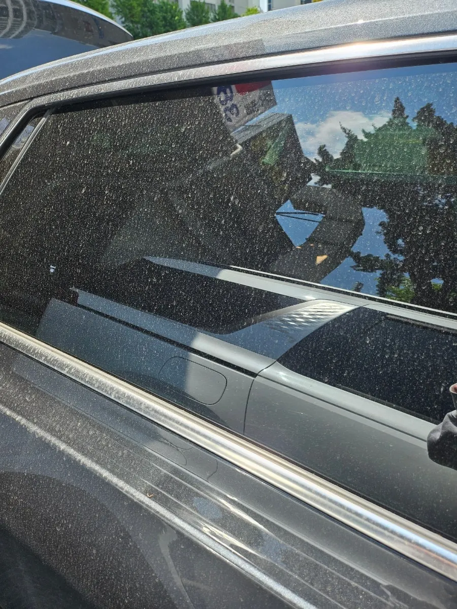 Car glass with water marks left after rain