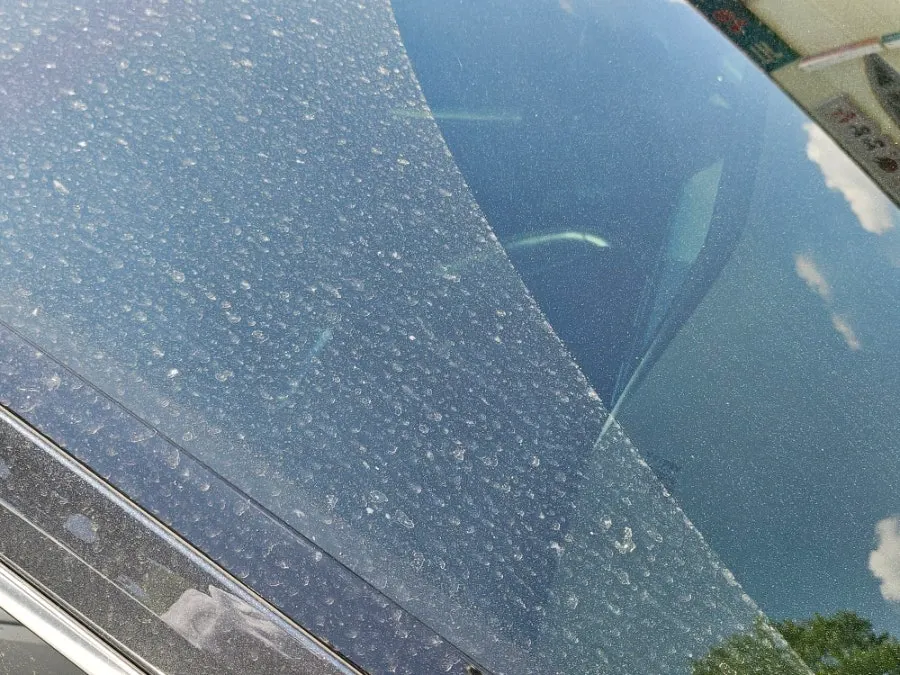 Car with dirt remaining before oil film removal