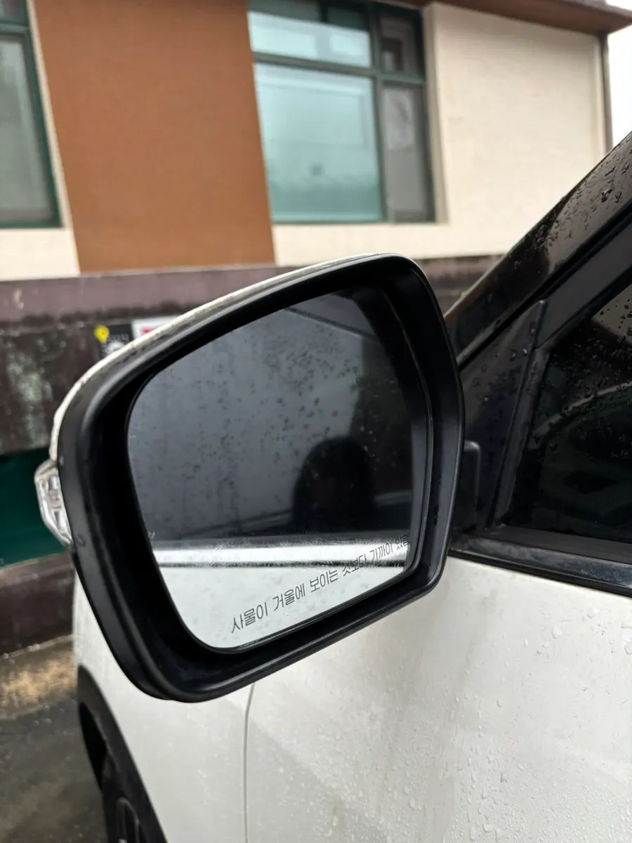 Car glass being prepared for film-removal work