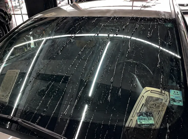 Water sprayed on vehicle glass after using CleanView
