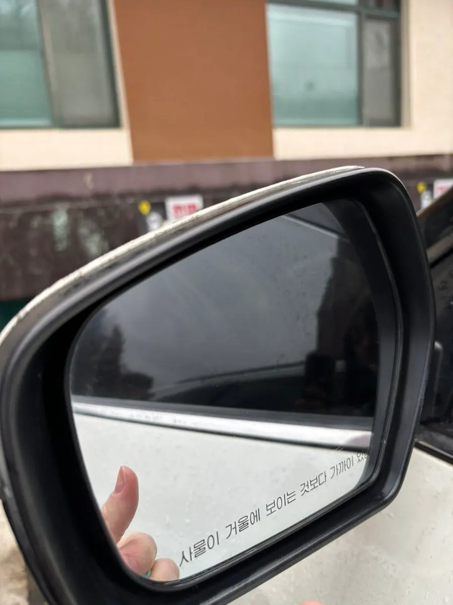 Rubbing car glass with the dedicated towel