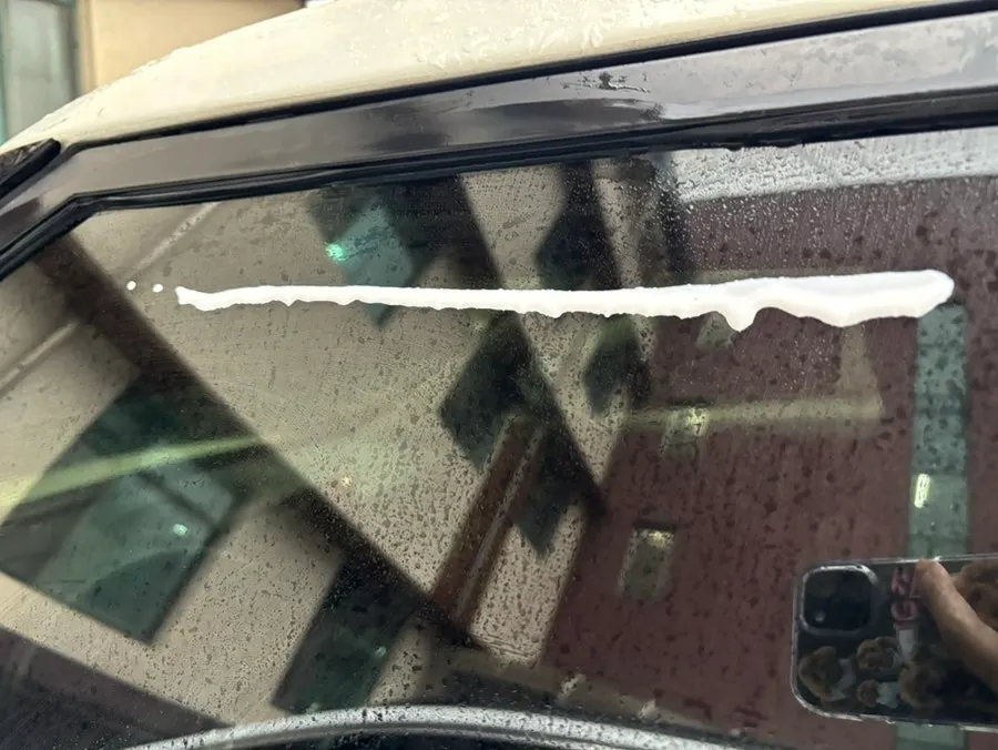 Car side window after film removal following the windshield