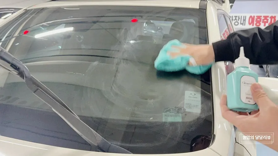 Car glass checked after oil film removal