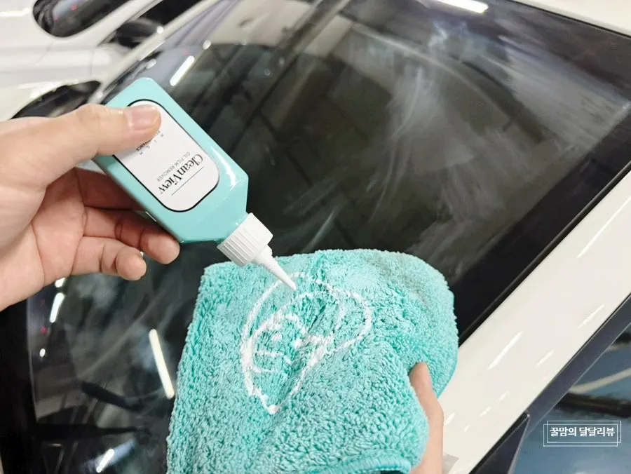 Car glass checked after a self-service wash and oil film removal