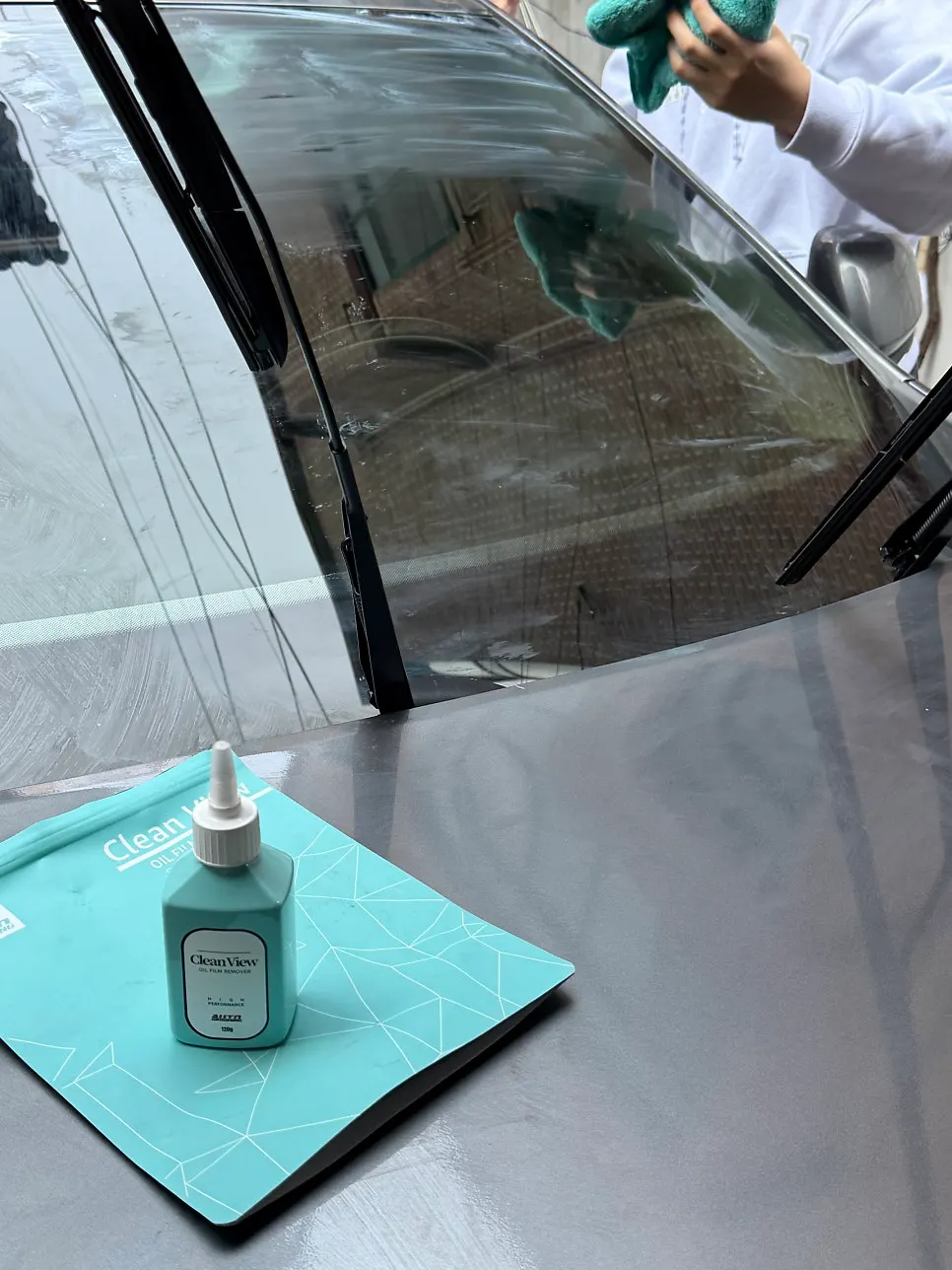 Car glass treated with Clean View during a self-service car wash
