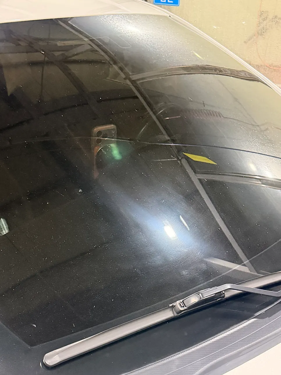 Removing oil film from car glass with Clean View