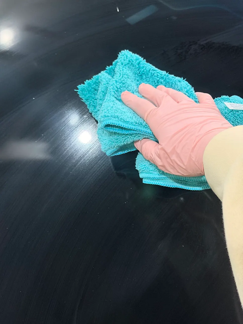 Wiping car glass with the dedicated towel