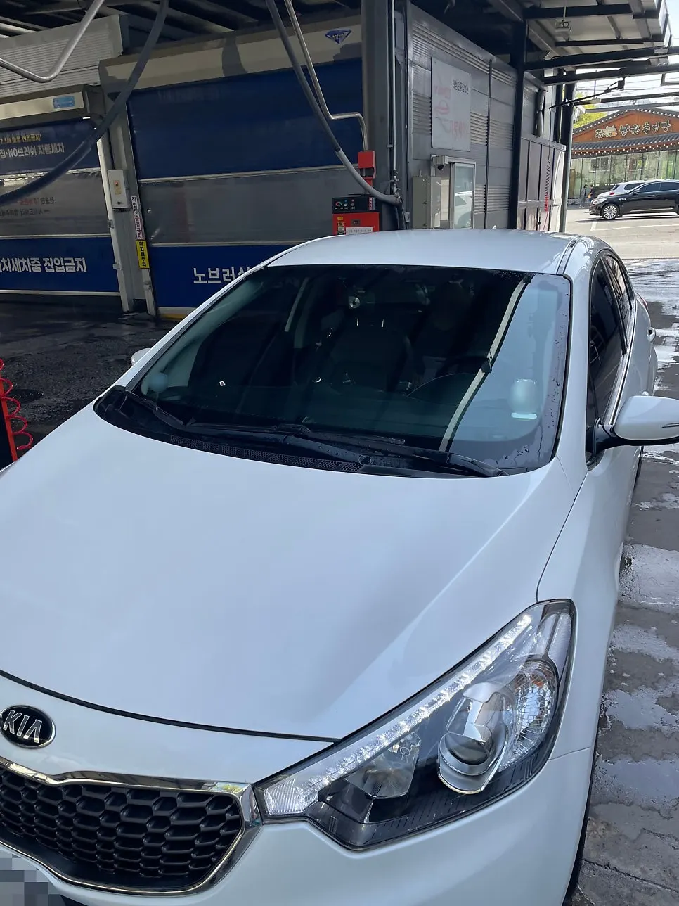 Car after the exterior wash at a self-service car wash