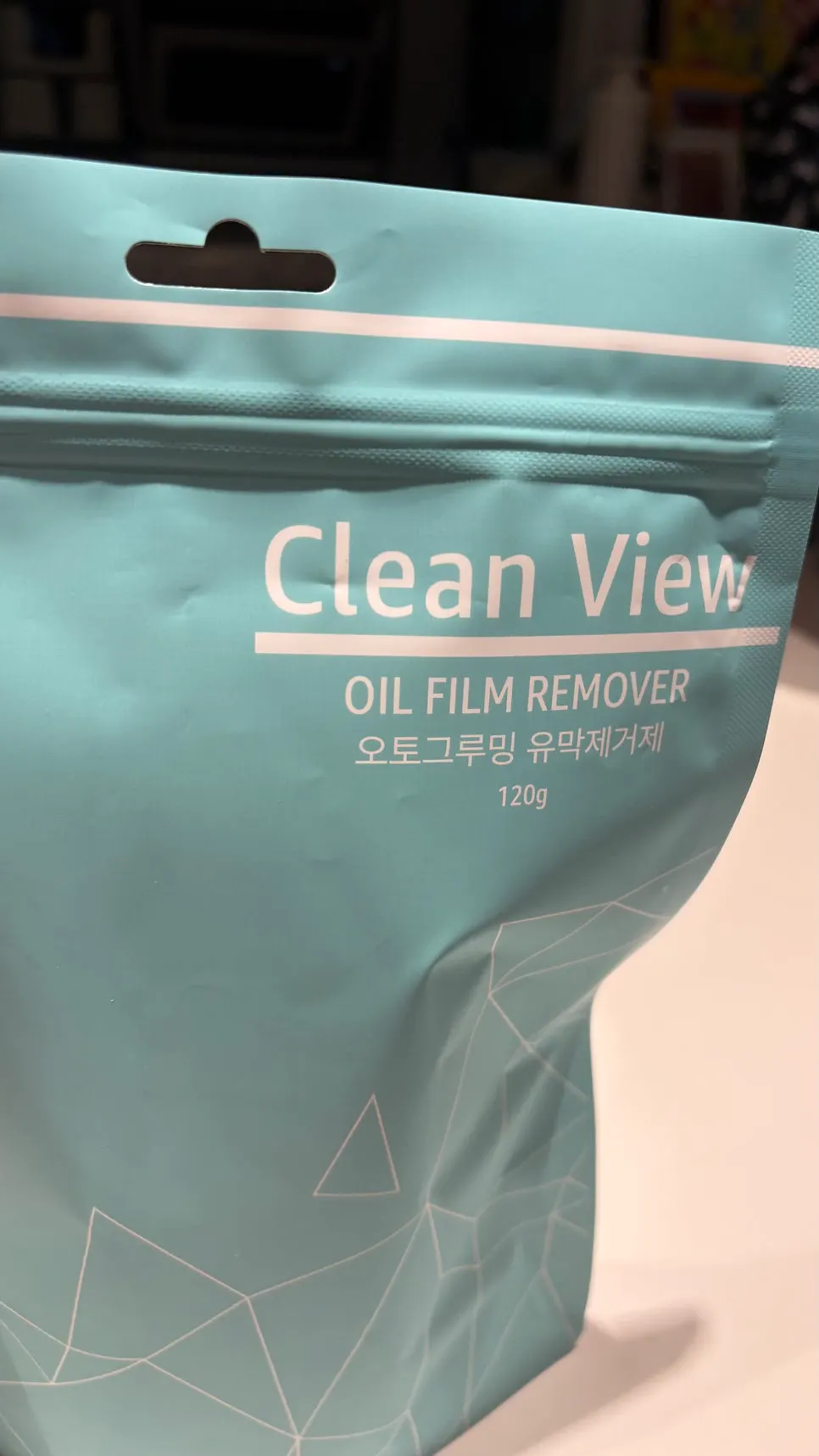 Liquid product used to remove oil film from a windshield