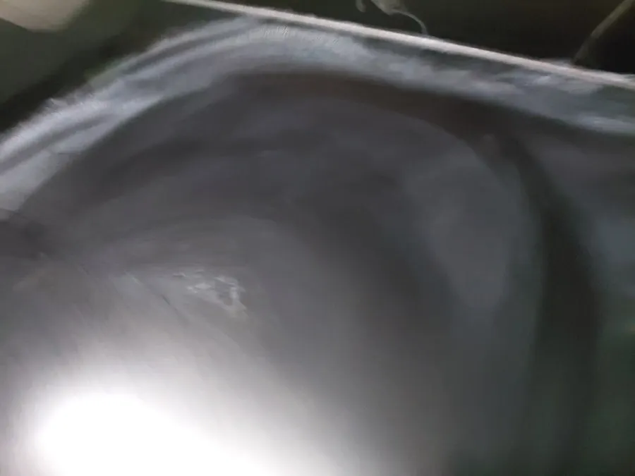 Wiping grime from glass with the dedicated towel