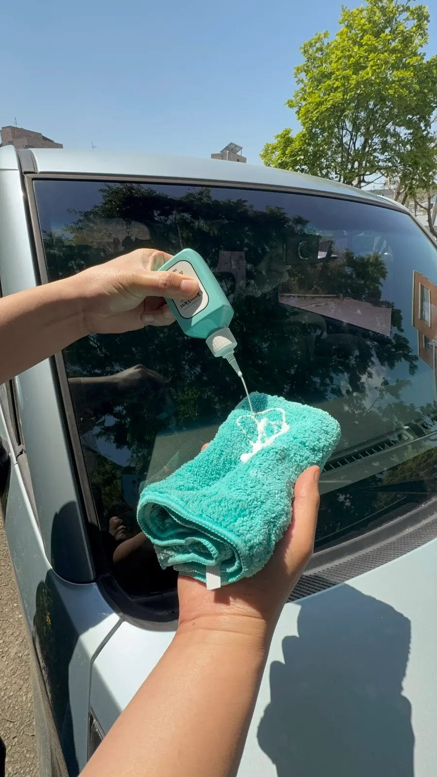 Car glass rinsed with water after using glass film remover