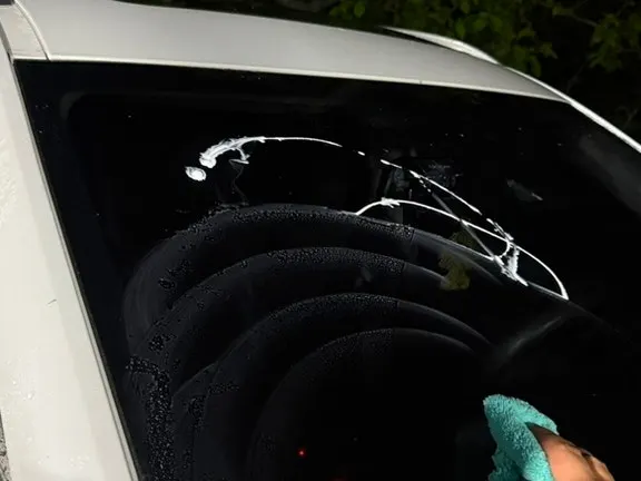 Applying Clean View oil film remover to a car window