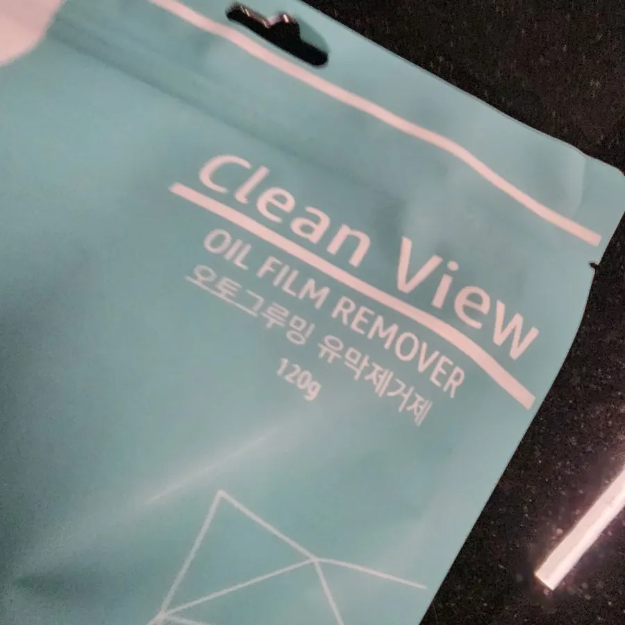 Using a product to remove oil film from car glass