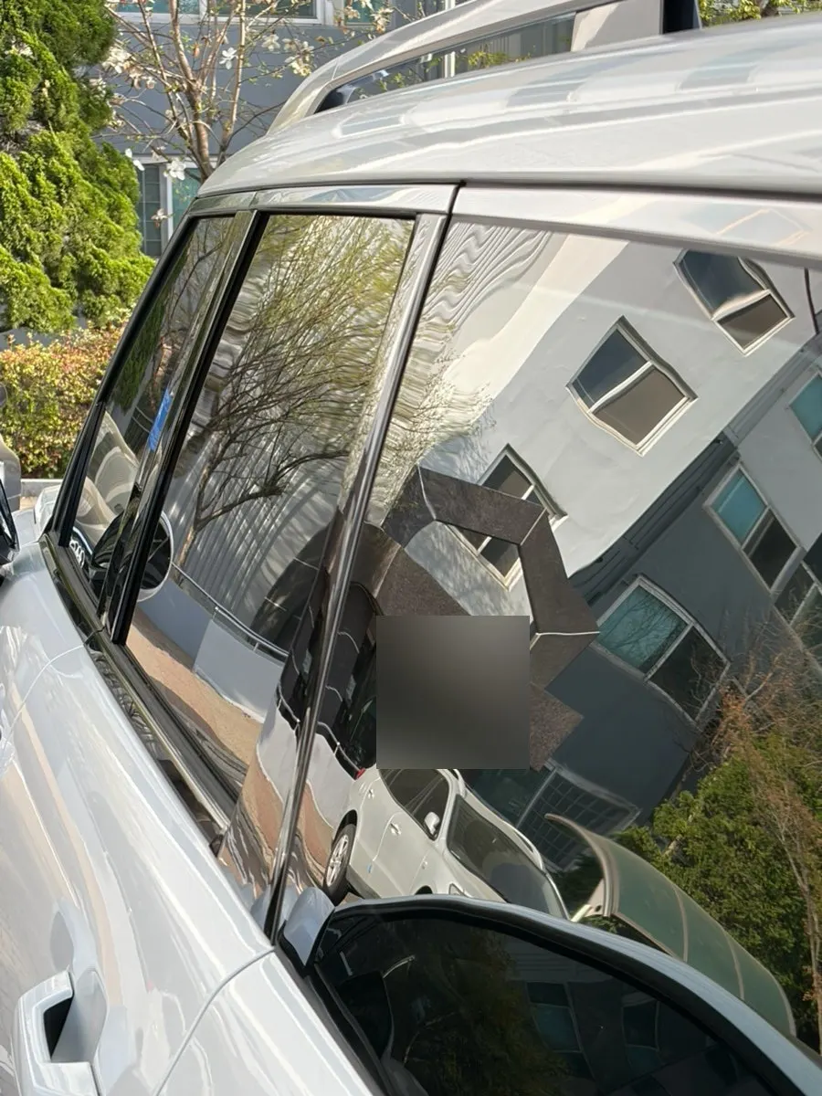 Car windshield after completing oil film removal at a self-service car wash