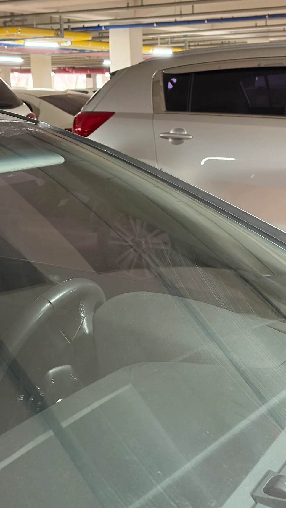 Car glass after using Clean View in a parking garage