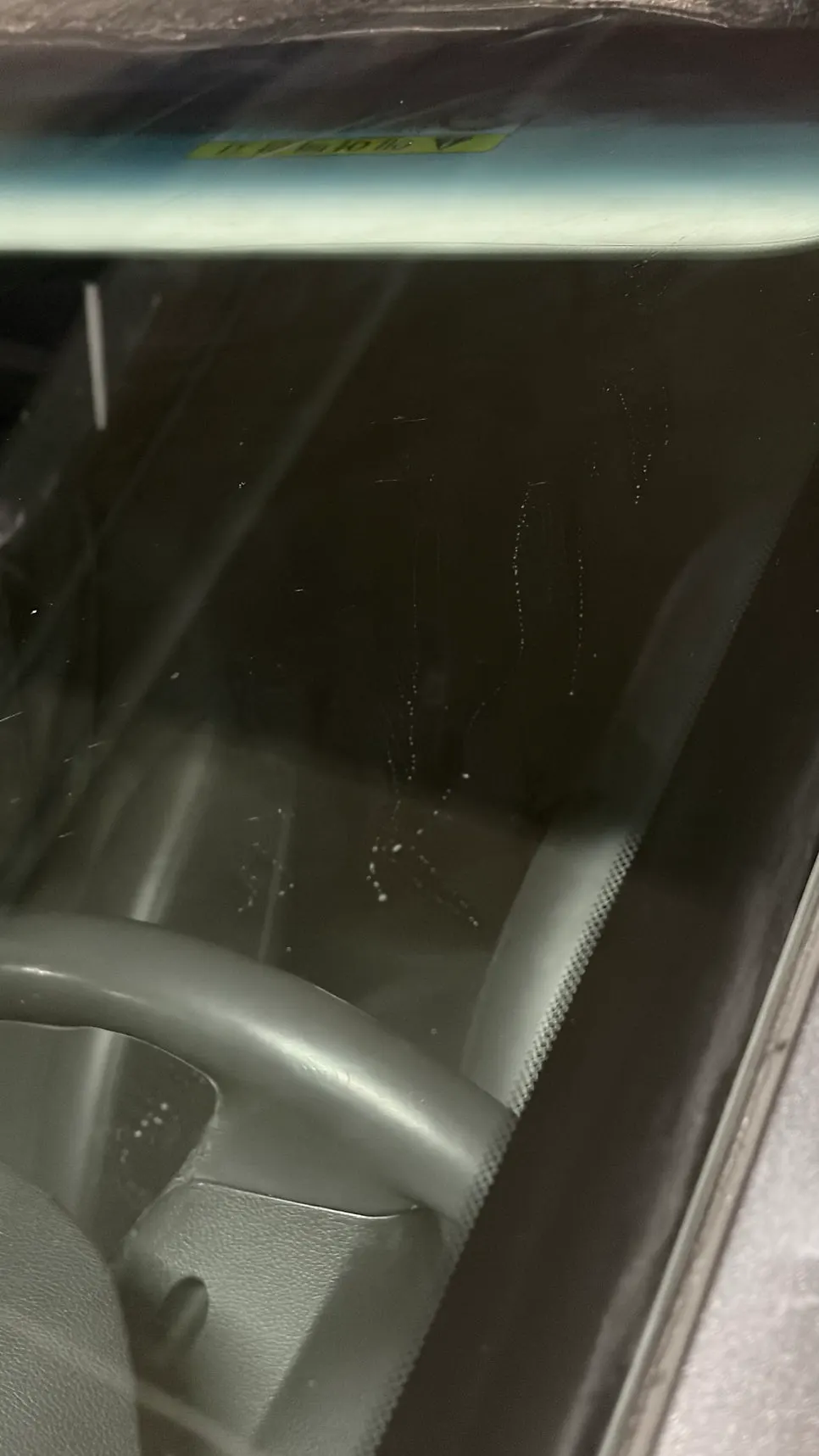 Front windshield with dust wiped away using the dedicated towel