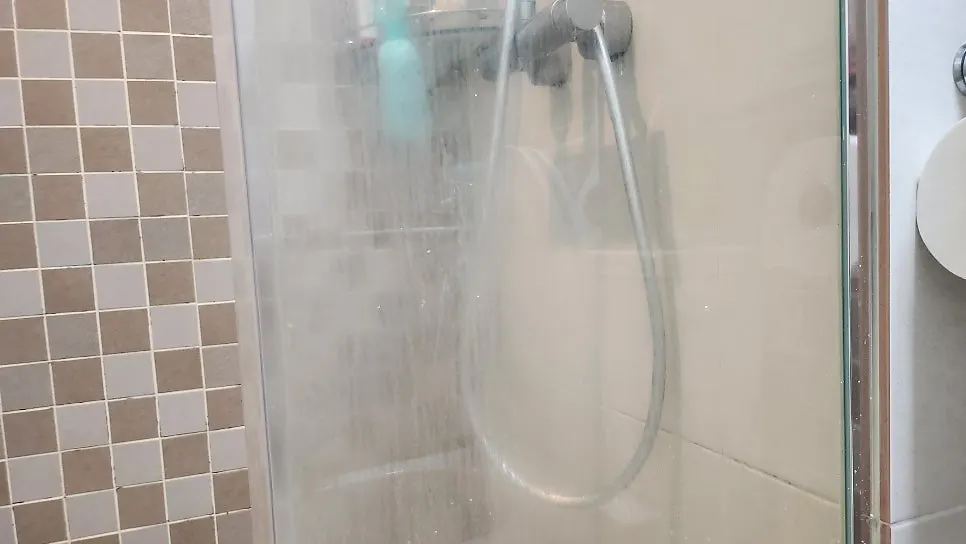 Cleaning the bathroom shower glass