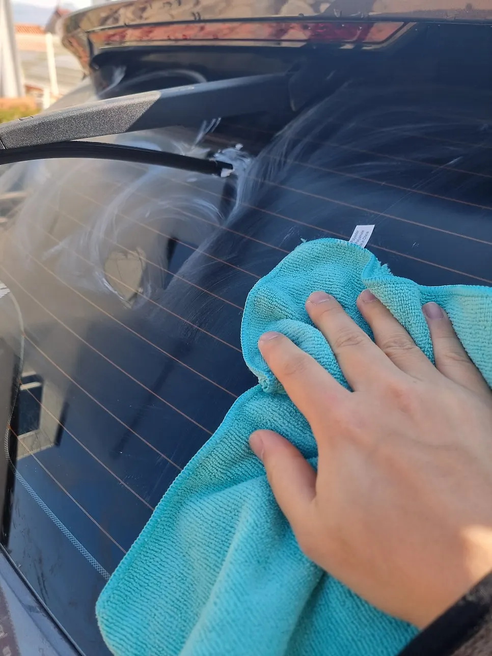 Car glass wiped clean of dirt before applying Clean View