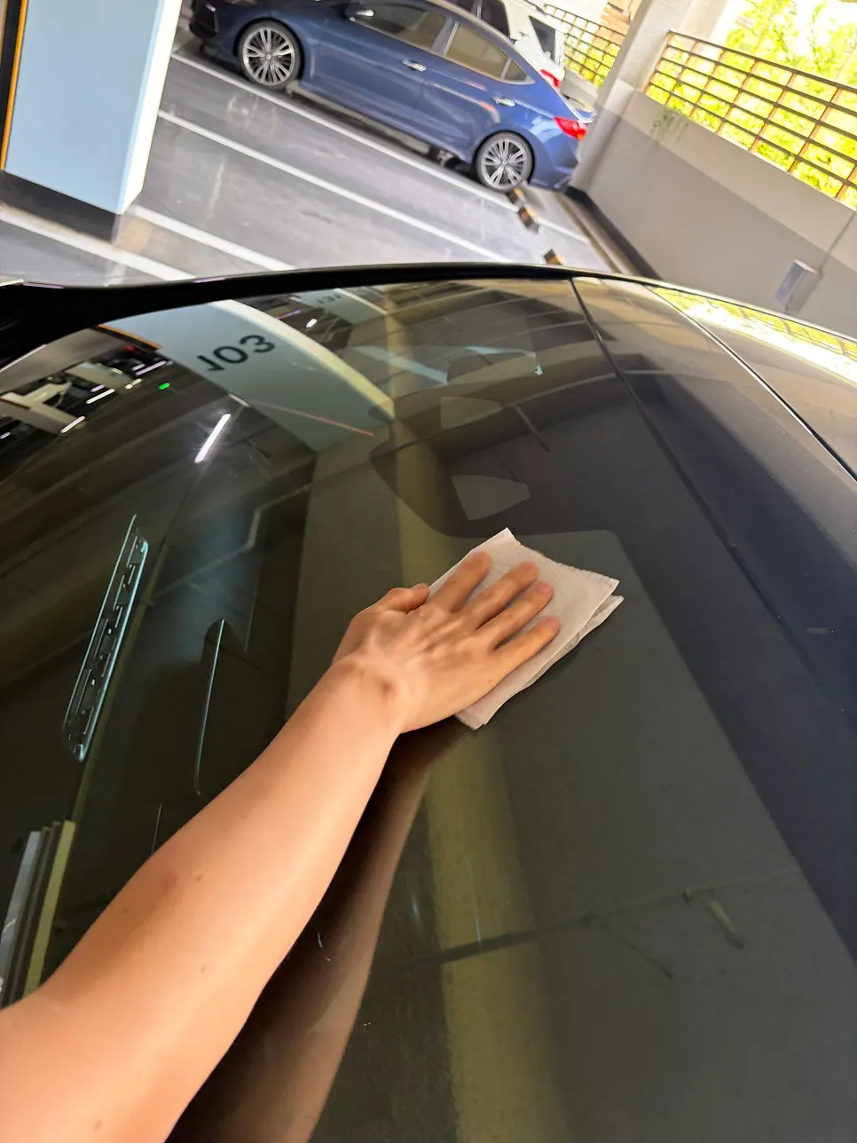Windshield wiped of dust and debris before treatment