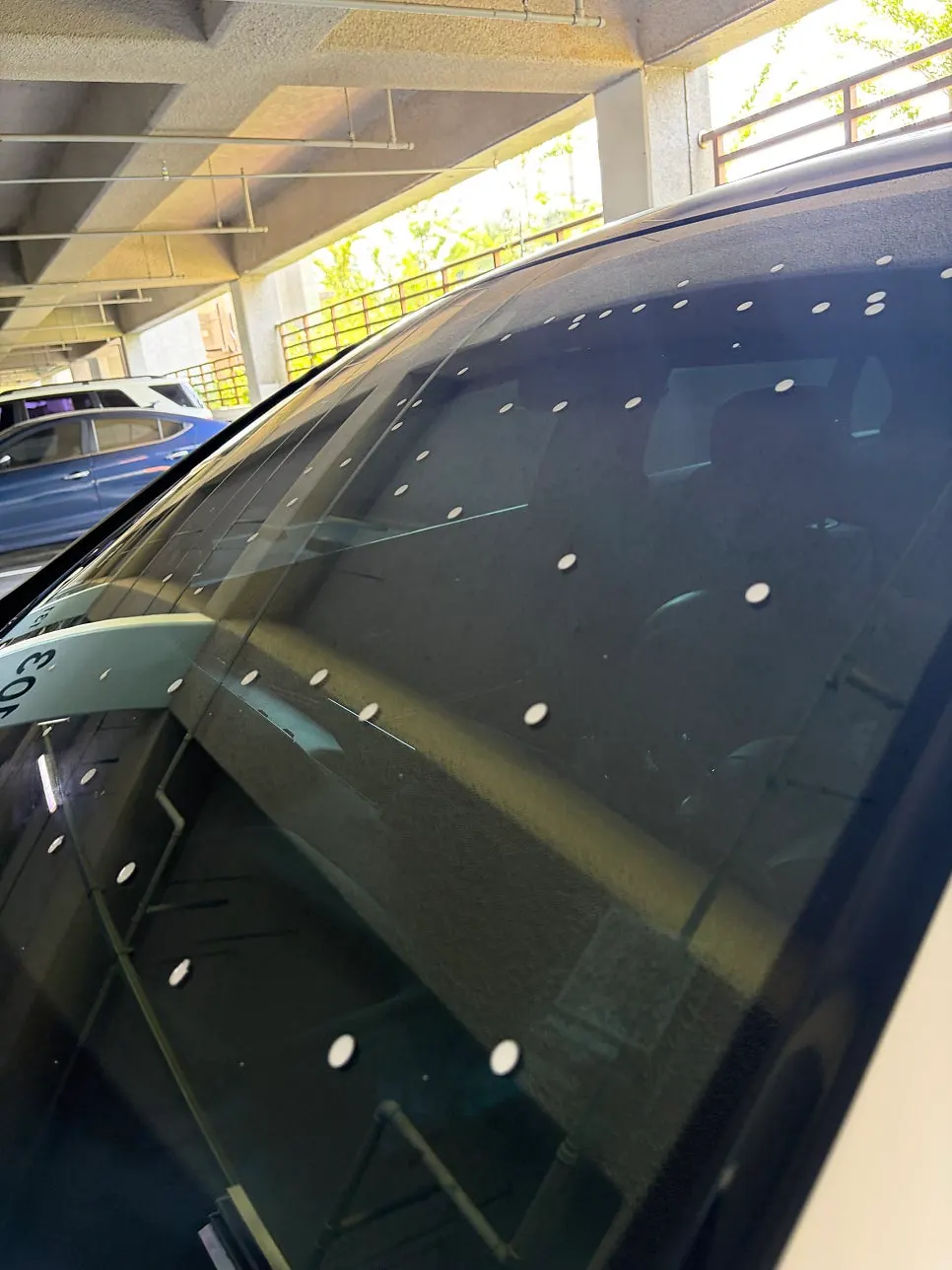 Large windshield being treated section by section