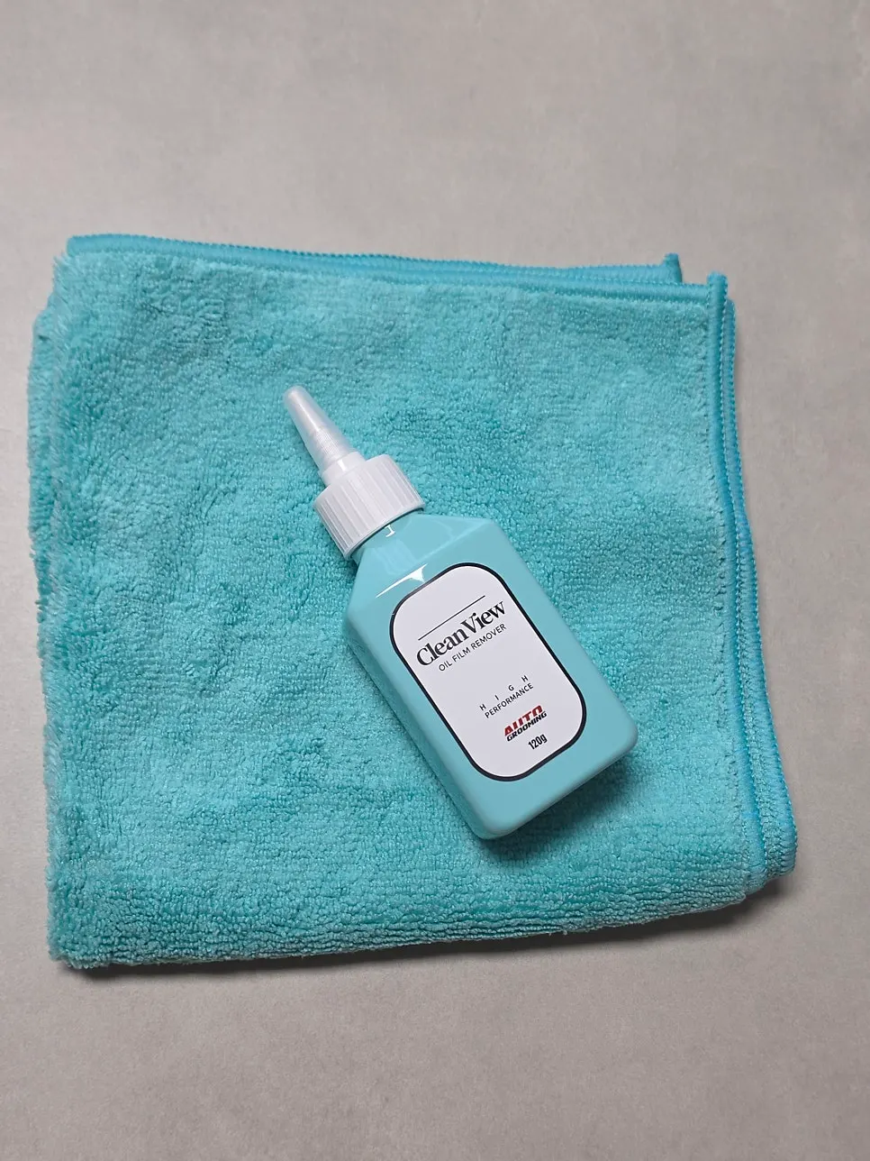 Clean View oil-film remover for use on a car windshield