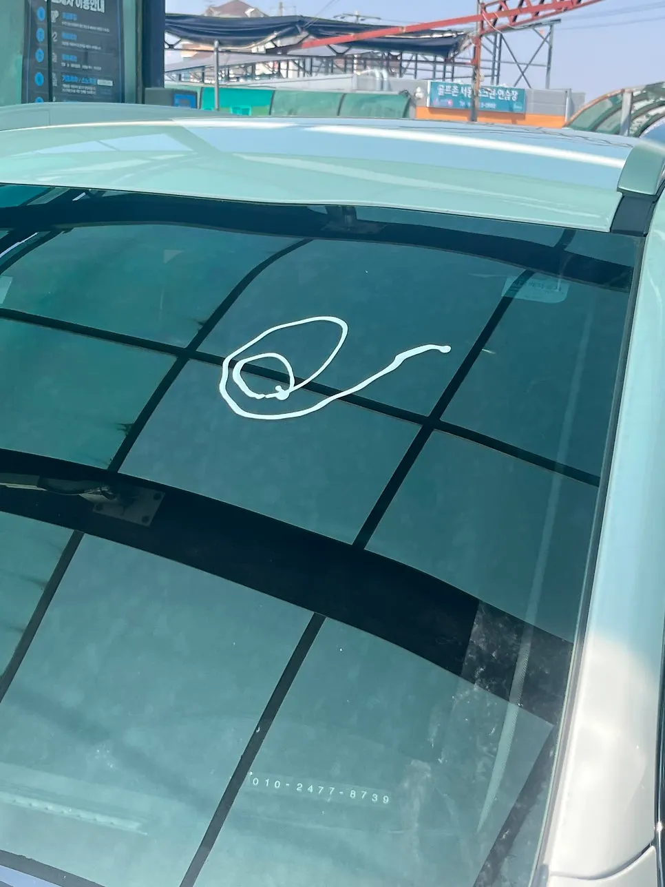Car window before oil film removal