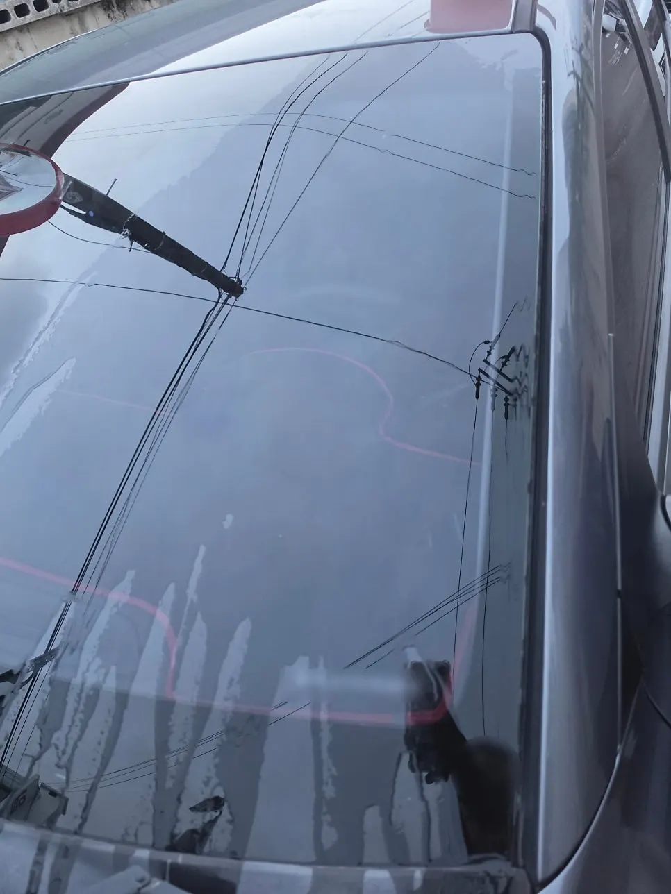 Applying Clean View oil-film remover to a car windshield